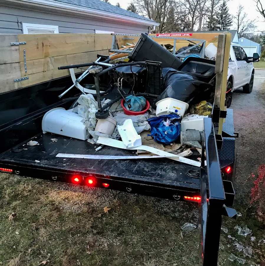 Roll-off dumpster delivered to a residential driveway in River Edge